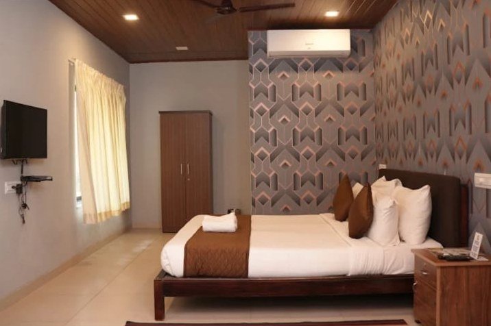 Room with textured wall and wooden ceiling